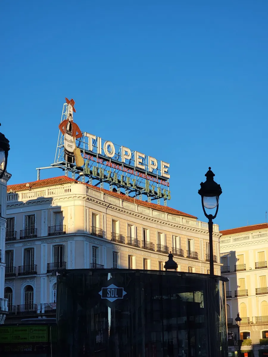 The Tío Pepe sign above Puerta del Sol at sunset